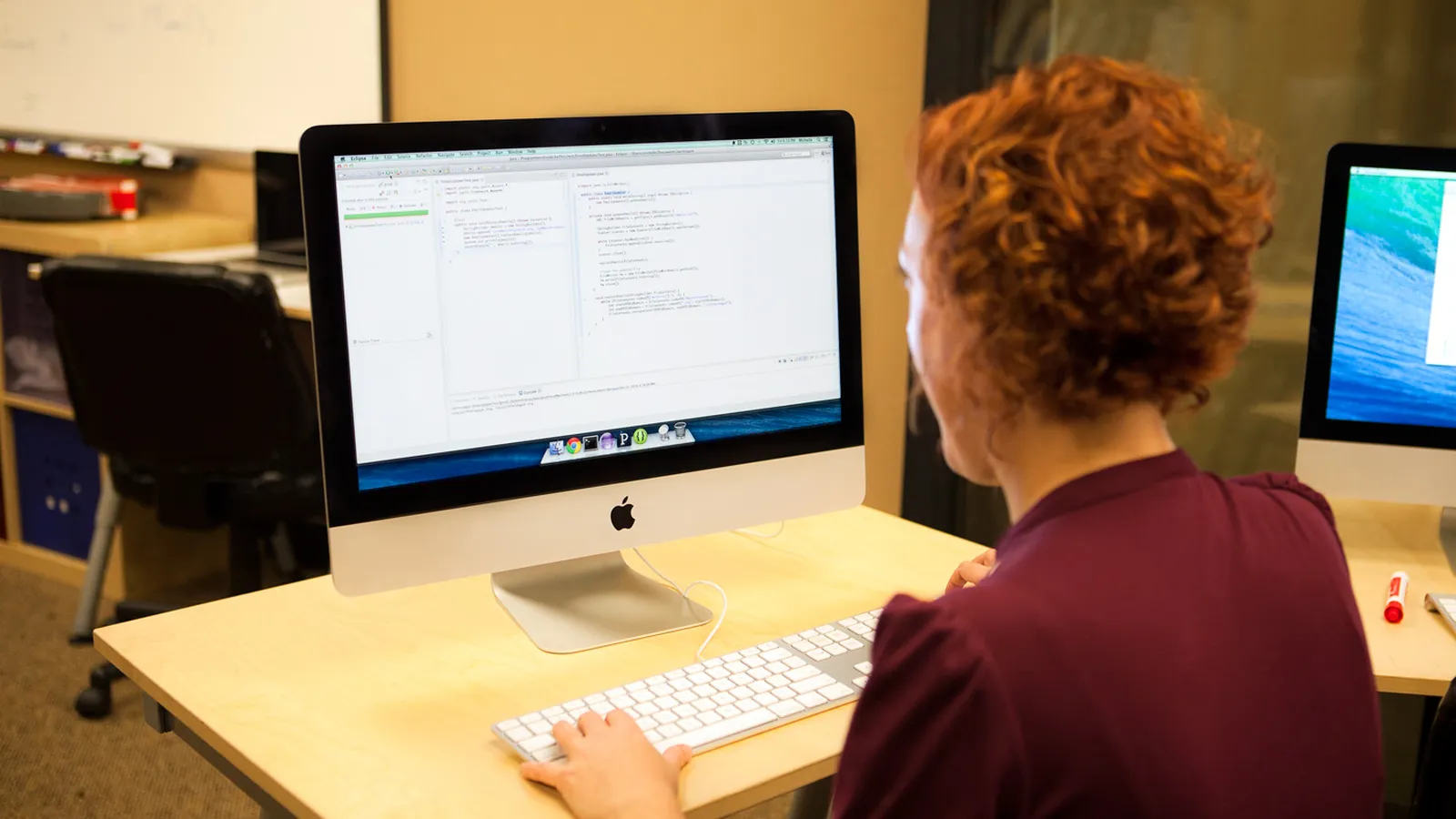 Developer writing code with unit-test output visible